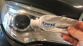 Toothpaste in front of a headlight, highlighting secret car cleaning tips