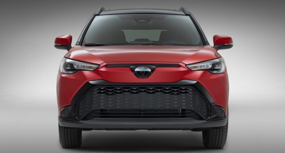 A red 2022 Toyota Corolla Cross Hybrid subcompact SUV.