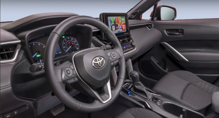 The interior of a 2023 Toyota Corolla Cross Hybrid subcompact SUV. 