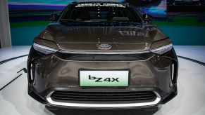 A grey Toyota bZ4X parked indoors.