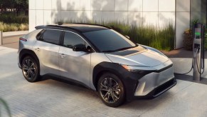 A gray 2023 Toyota bZ4X electric SUV is charging.