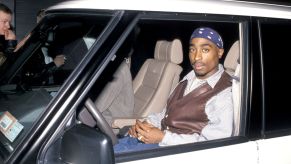 Tupac Shakur seated in a car during 'Red Rock West' at Club USA in New York City