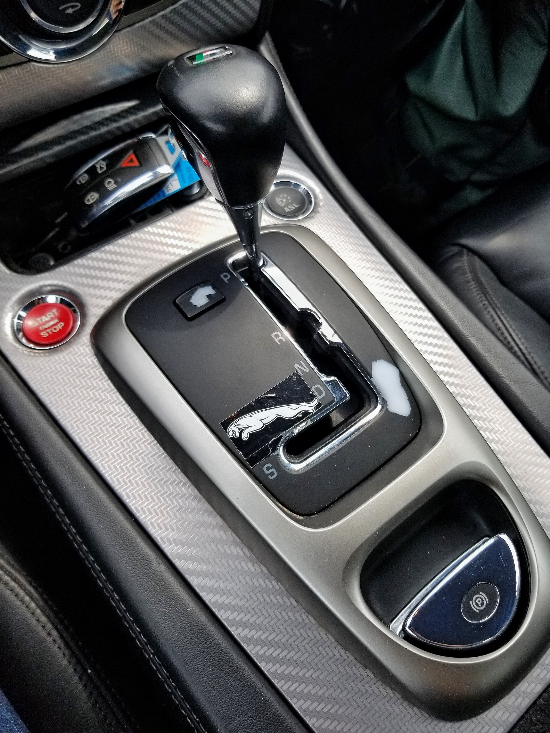 The silver-and-black center console in a used 2007 Jaguar XKR Coupe