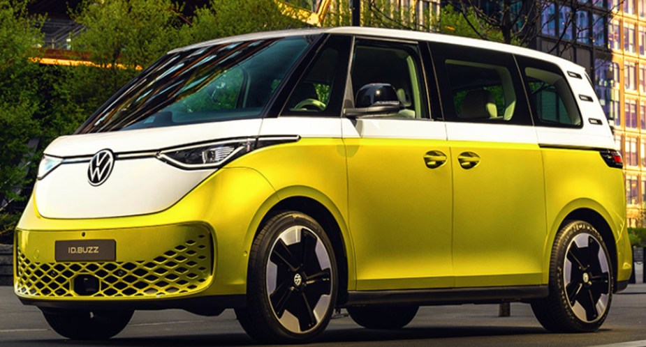 A white and yellow 2024 Volkswagen ID. Buzz electric microbus is parked. 