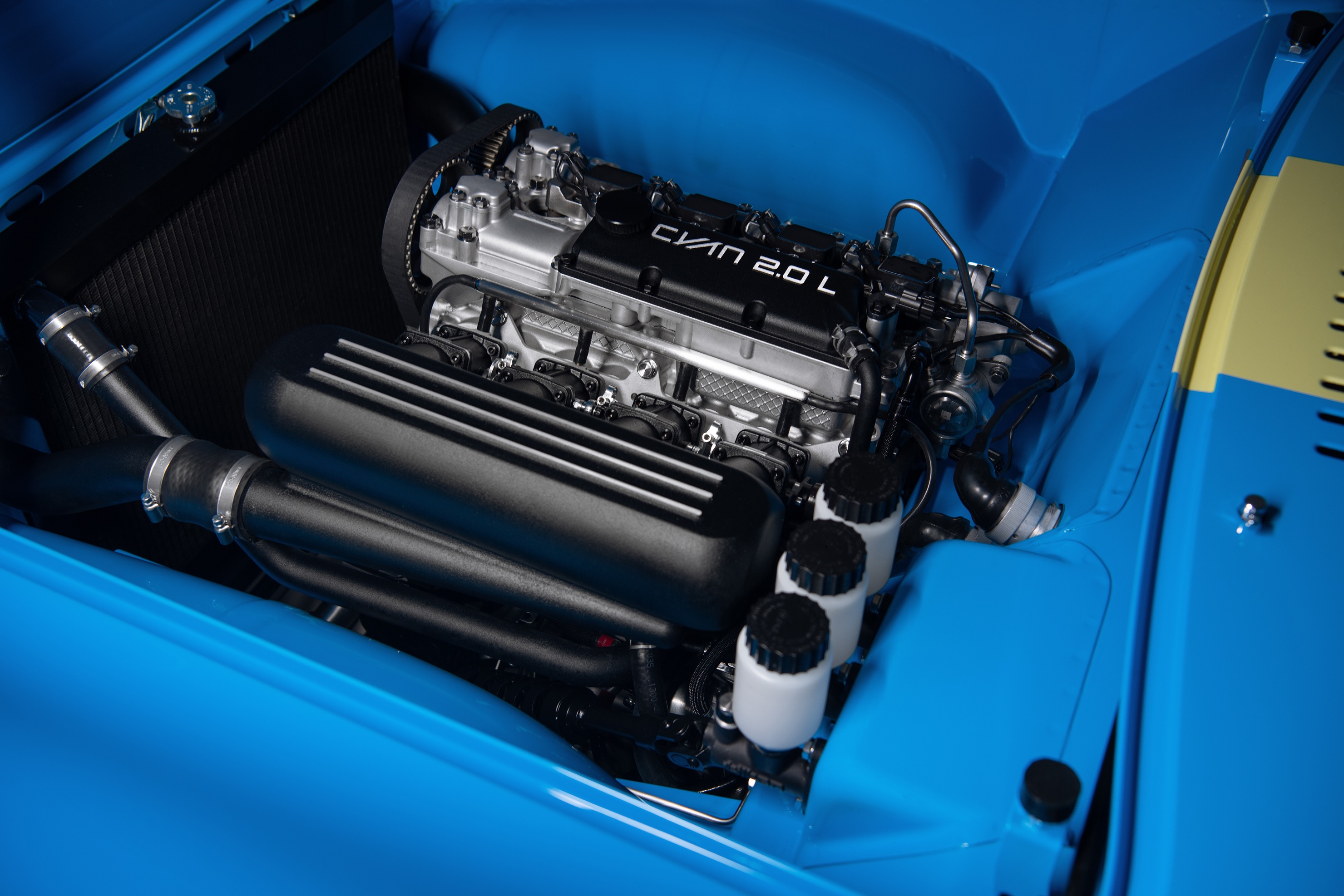 A blue Volvo P1800 Cyan's turbocharged 2.0-liter four-cylinder engine