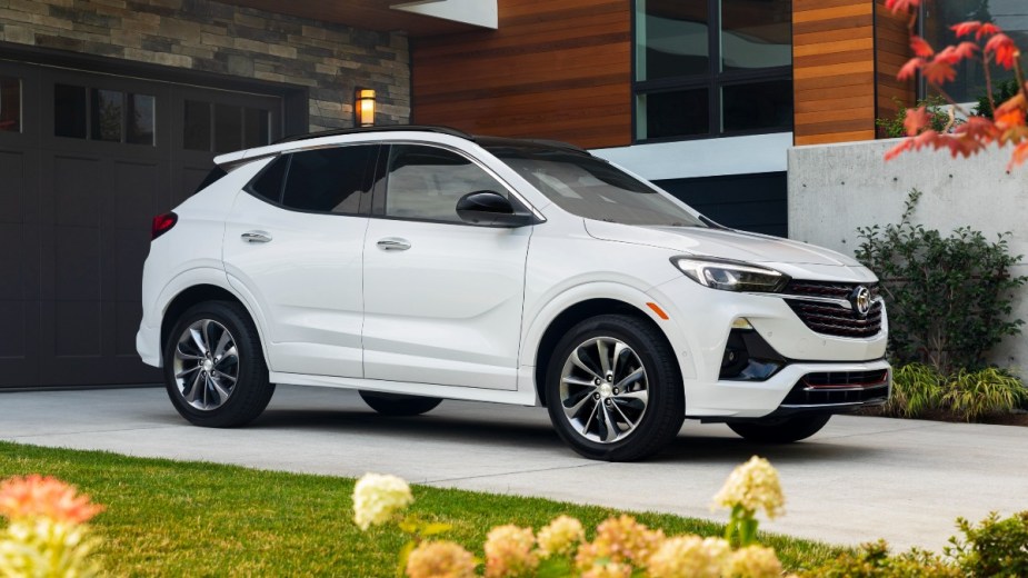 White 2023 Buick Encore GX parked in a driveway, highlighting its release date and price