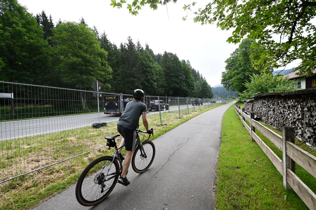 A cyclist riding on the sidewalk in lieu of a bike lane