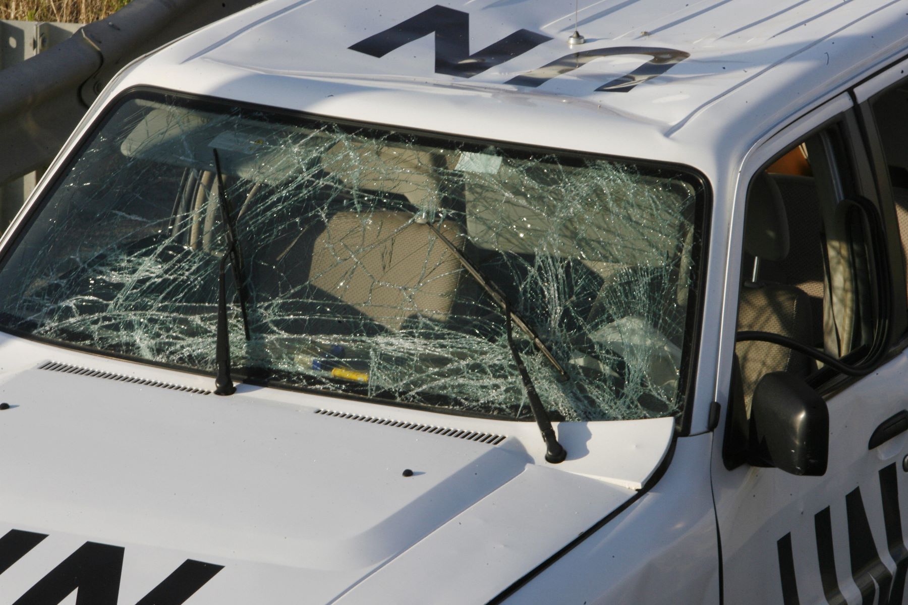 A shattered windshield of a U.N. vehicle after a roadside blast in Rmeileh