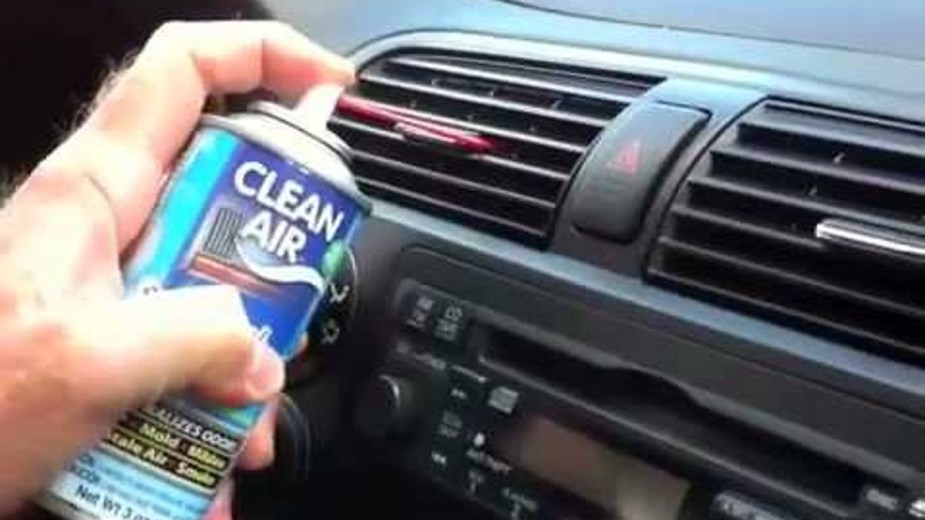 Using compressed air to clean air vents in your car