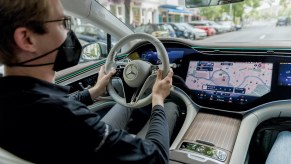 A man drives a 2022 Mercedes-Benz EQS
