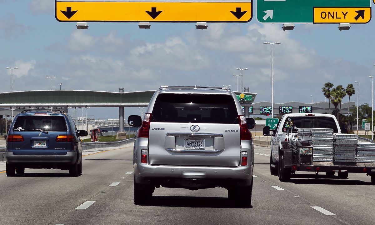Cars driving on the highway. 20% of cars in Florida have an open recall.