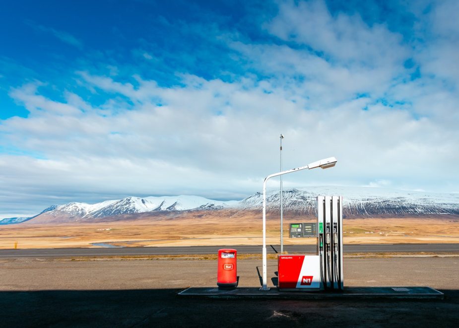 Remote gas pump in front of a mountain range.