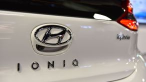 Close up of a white Hyundai Ioniq Hybrid car at an auto show.