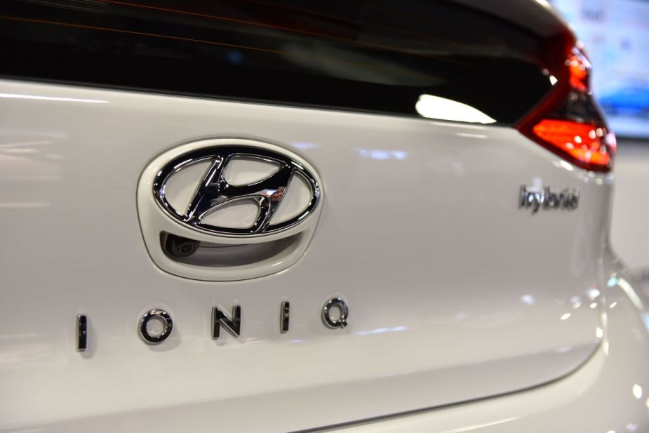 Close up of a white Hyundai Ioniq Hybrid car at an auto show. 