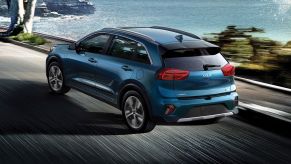 Blue Kia Niro model with available Kia Drive Wise features