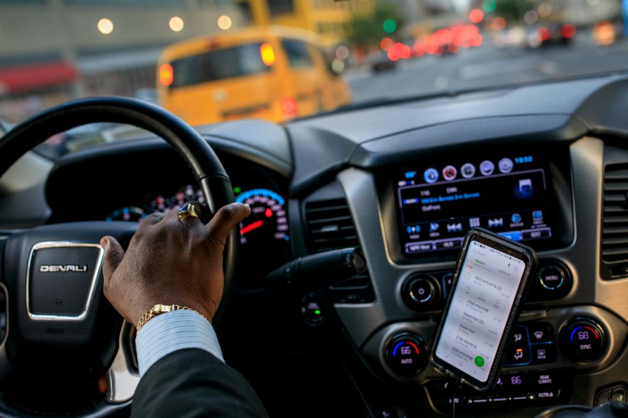 A driver drops off passengers at a Broadway play.