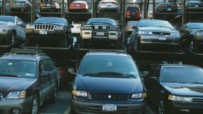Minivans and SUVs in a Manhattan lot parking garage