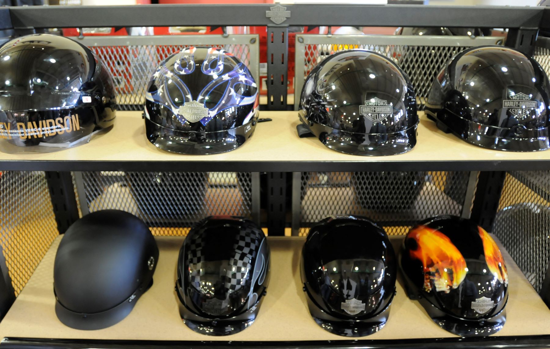A shelf of Harley-Davidson motorcycle helmets near other safety gear in the Bern Township