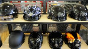 A shelf of Harley-Davidson motorcycle helmets near other safety gear in the Bern Township