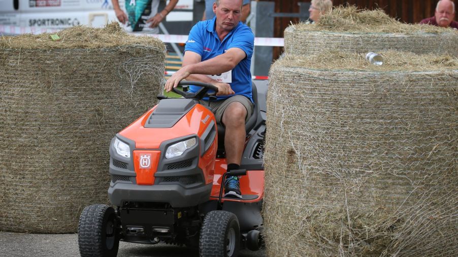 A riding lawn mower race and obstacle course taking place in Bavaria