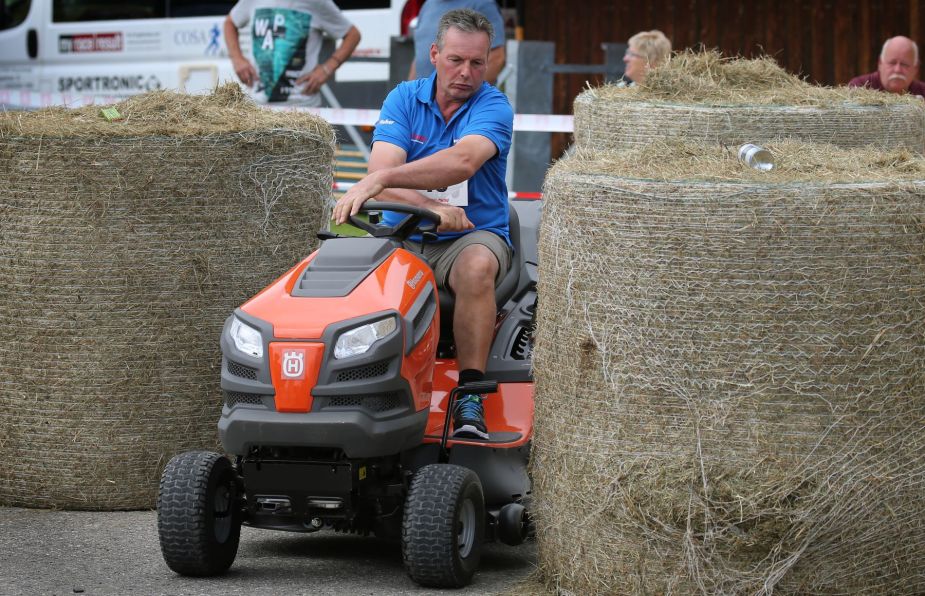 A riding lawn mower race and obstacle course taking place in Bavaria