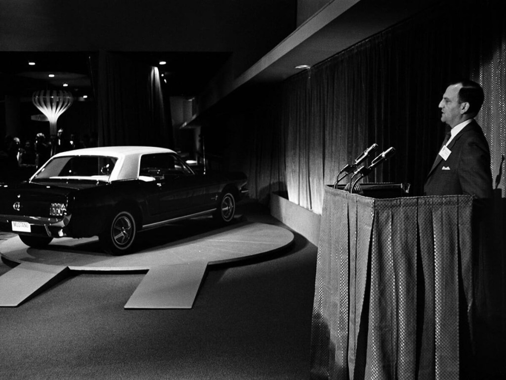 A 1964 1/2 Ford Mustang, named for the P51 Mustang fighter plane of WWII, is unveiled at the World's Fair. 