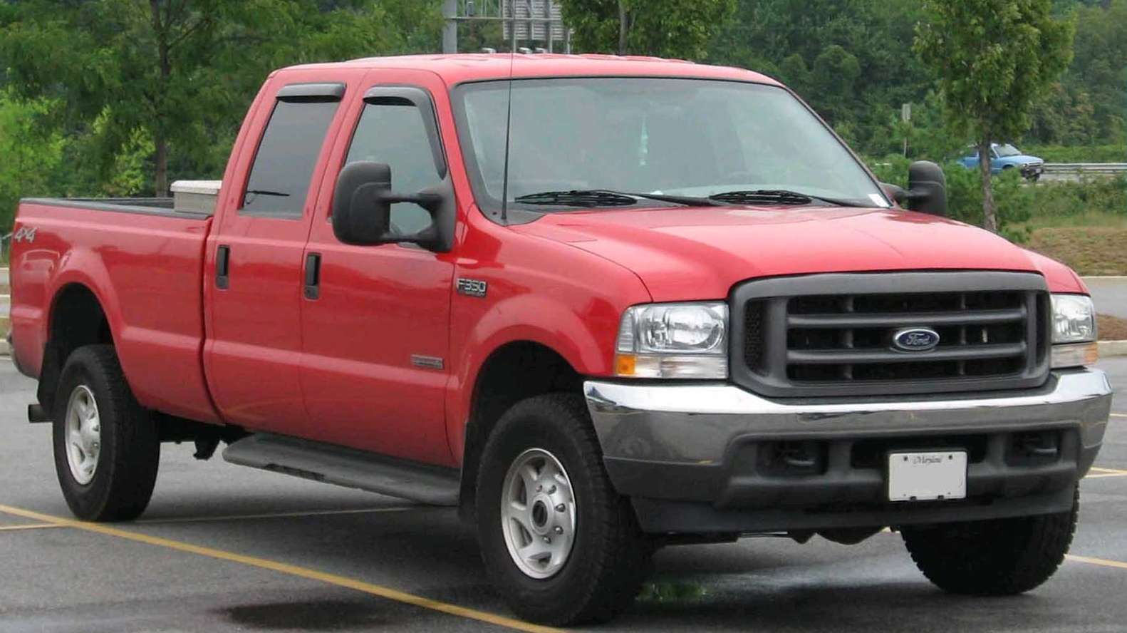 Red 1999 Ford F-350 parked in a parking lot