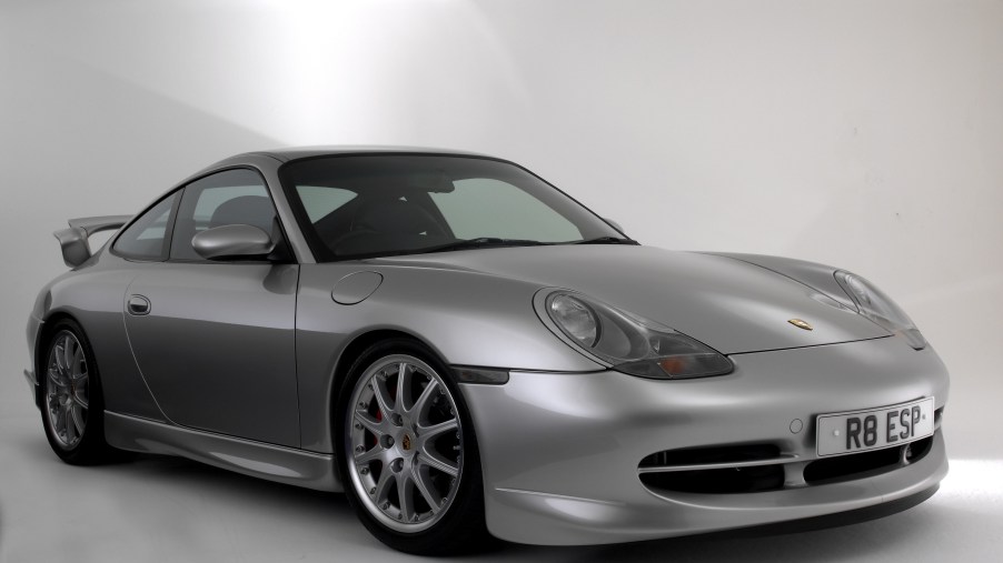 A silver 2000 996.1 Porsche 911 GT3 in a white studio