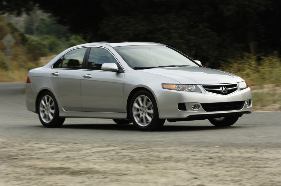 A silver 2008 Acura TSX going around a road corner