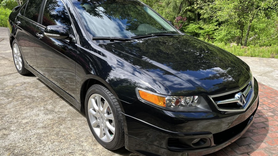 A black 2008 Acura TSX in a driveway