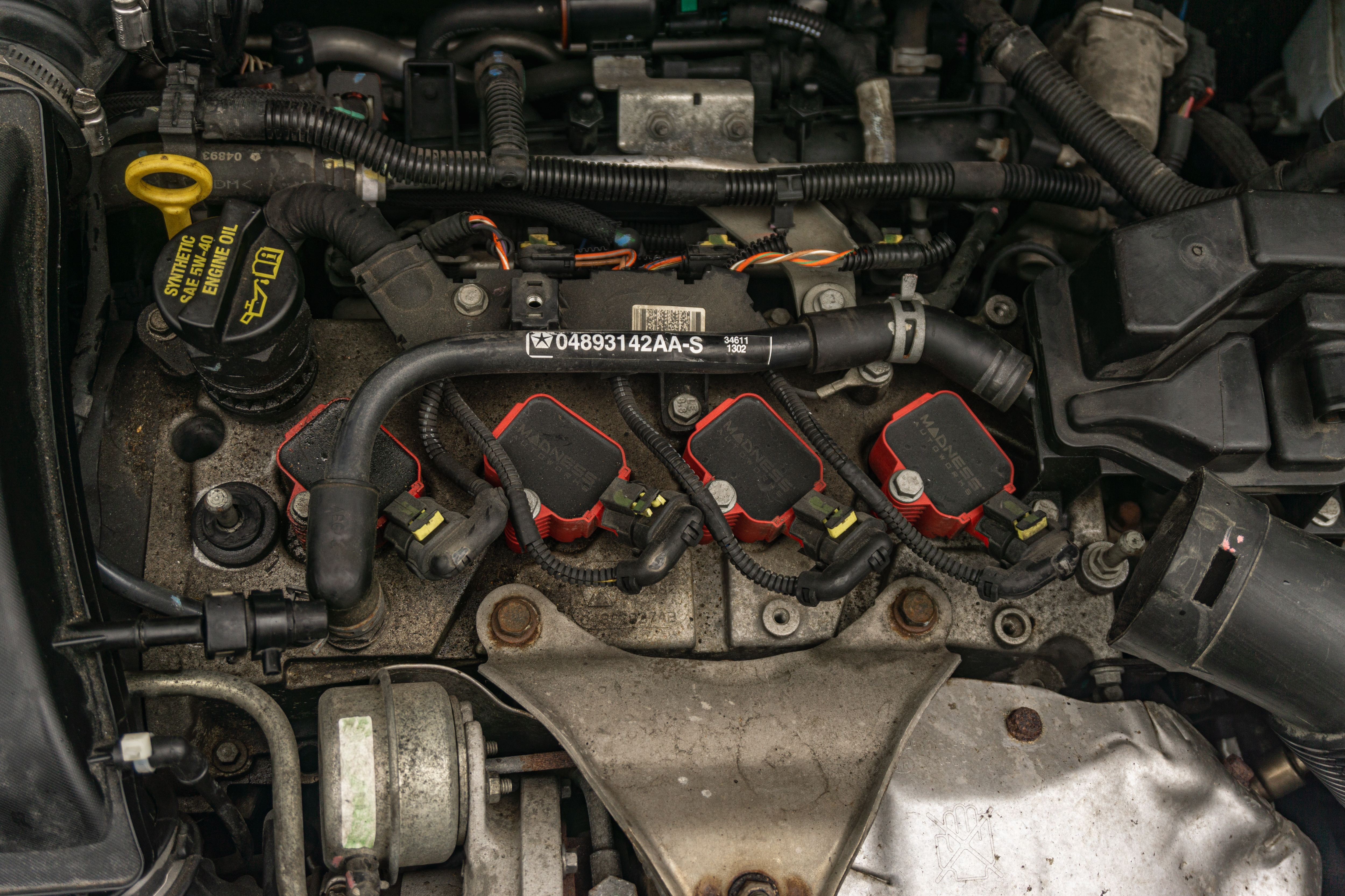 The overhead view of a 2013 Fiat 500 Abarth's ignition coils