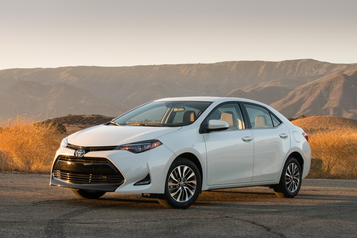A white 2017 Toyota Corolla parked at dusk