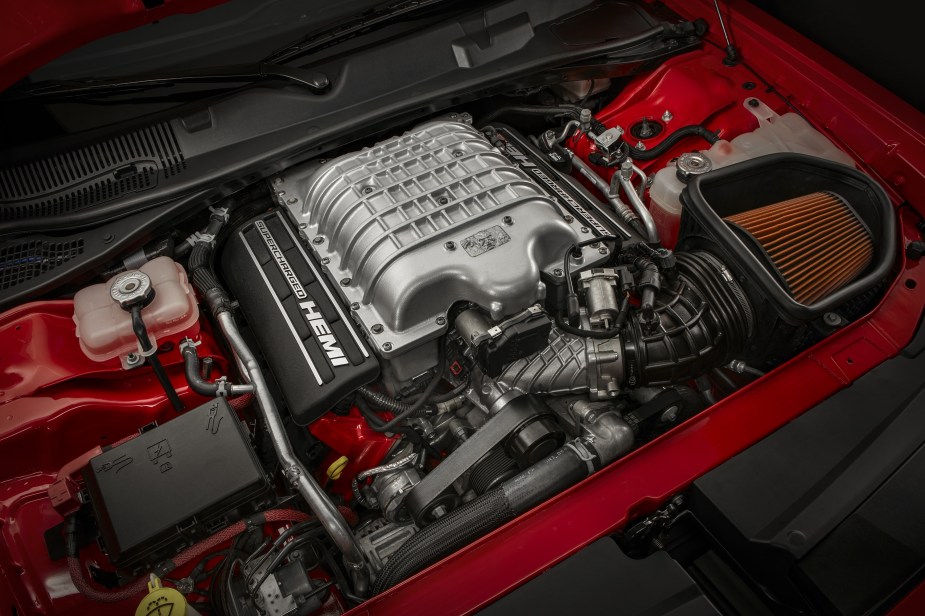 The supercharged 6.2-liter V8 under the hood of a red 2018 Dodge Challenger SRT Demon