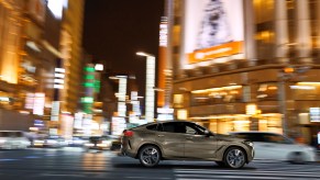 202 BMW X6 in a city at night