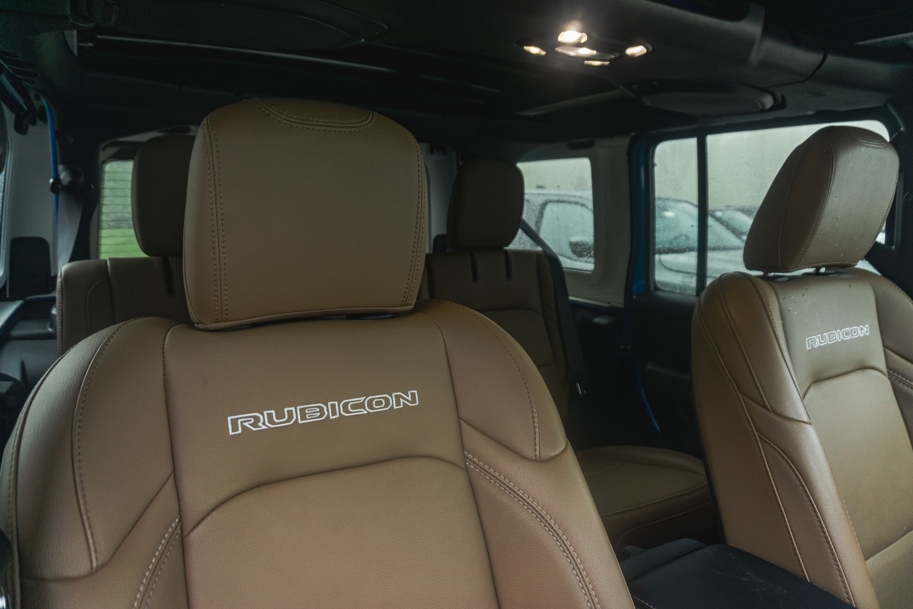 The interior and brown-leather seats of a 2021 Jeep Wrangler Unlimited Rubicon 4xe
