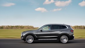 2022 BMW X3 in silver near a green filed