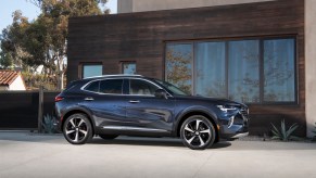 2022 Buick Envision parked in front of a house in blue