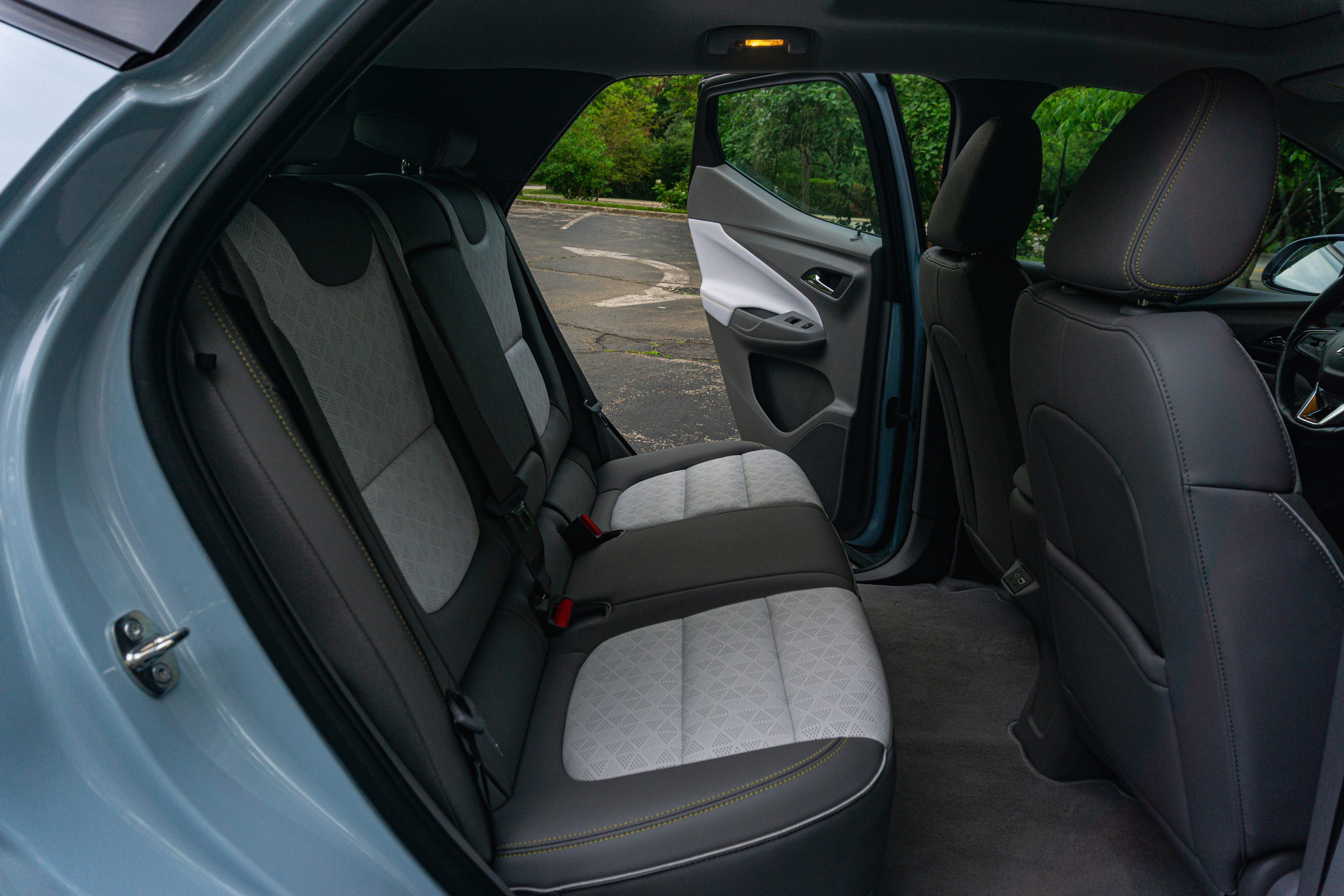 The gray-and-white-leather rear seats of a light-blue 2022 Chevrolet Bolt EUV