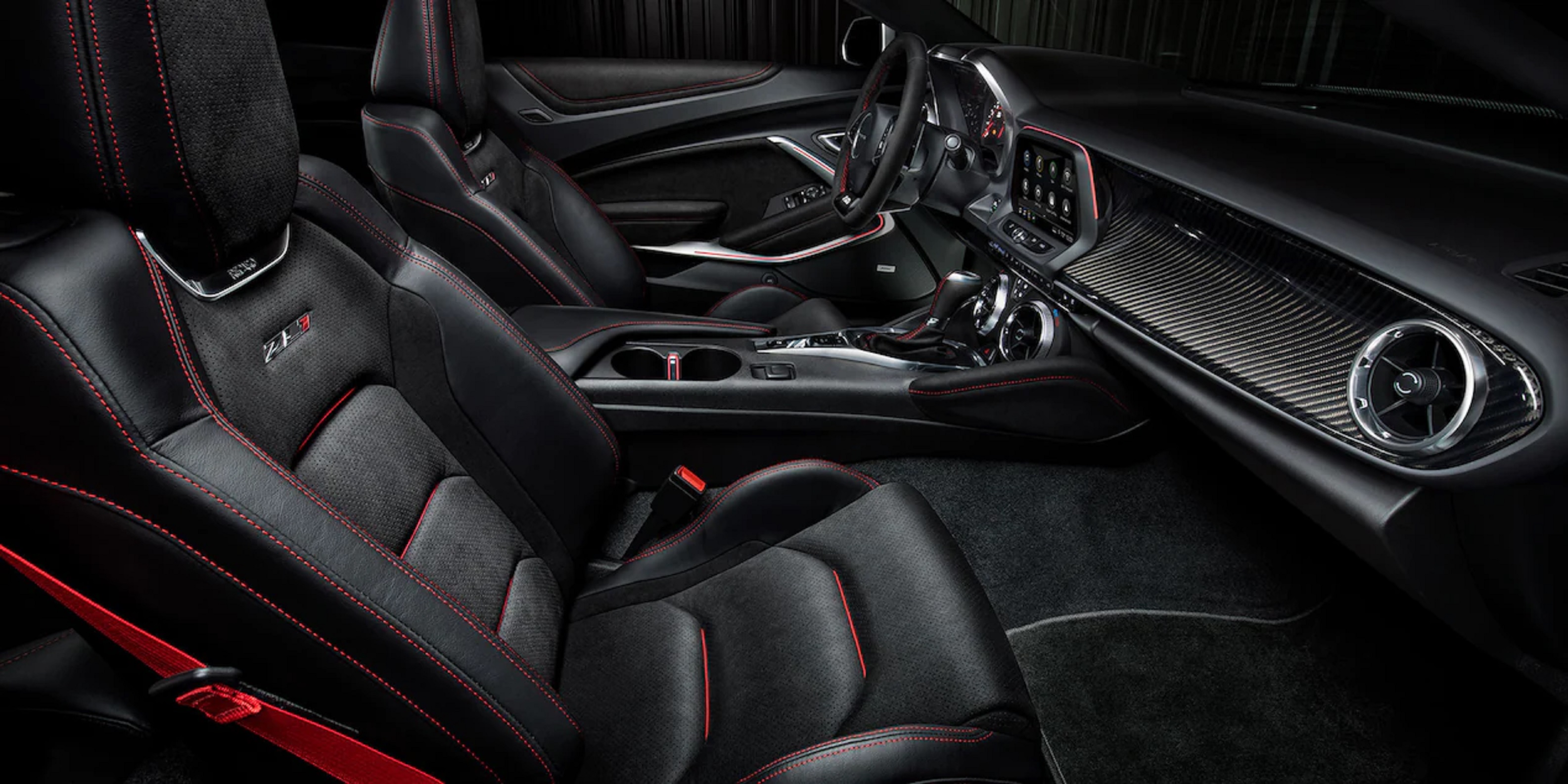 Front seats with black-red stitching and carbon fiber dashboard of the 2022 Chevrolet Camaro ZL1