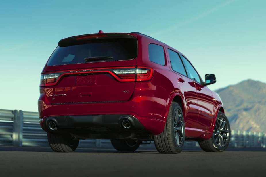 The back of a red 2022 Dodge Durango against a blue sky.
