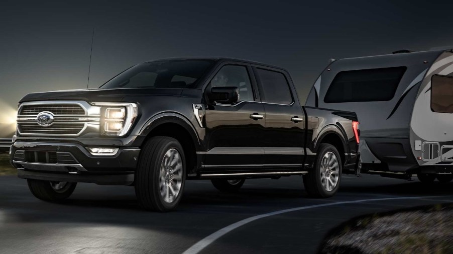 A Black 2022 Ford F-150 Towing at night; this is the best-selling truck in the market