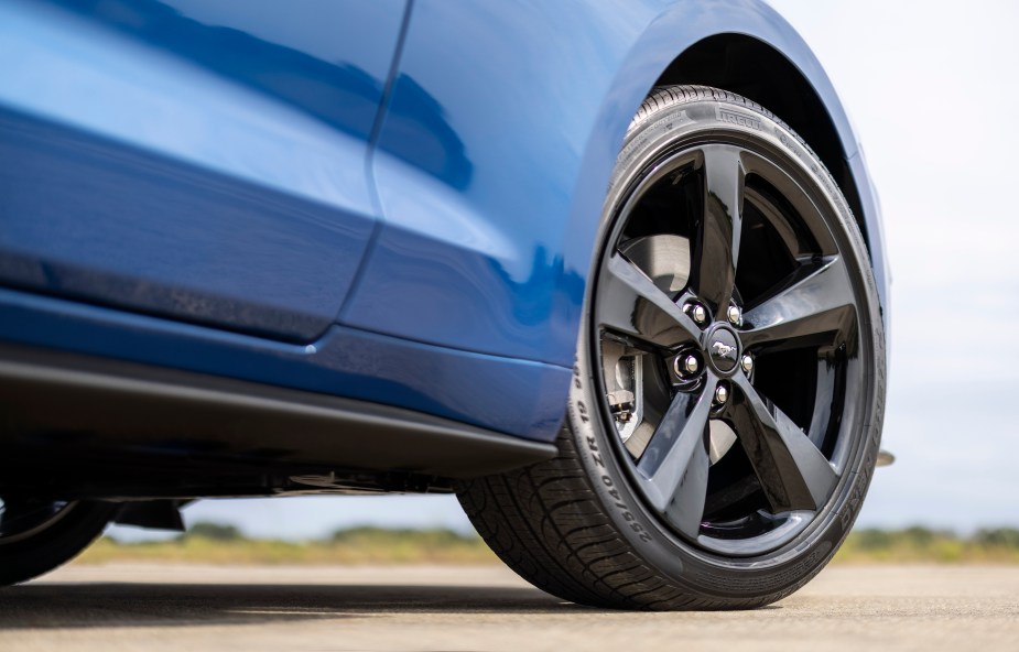 Close up on the tire of a blue 2022 Ford Mustang Stealth Edition