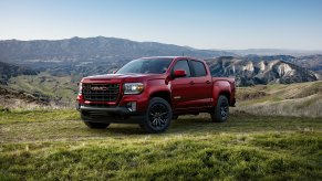 A red 2022 GMC Canyon on green pastures