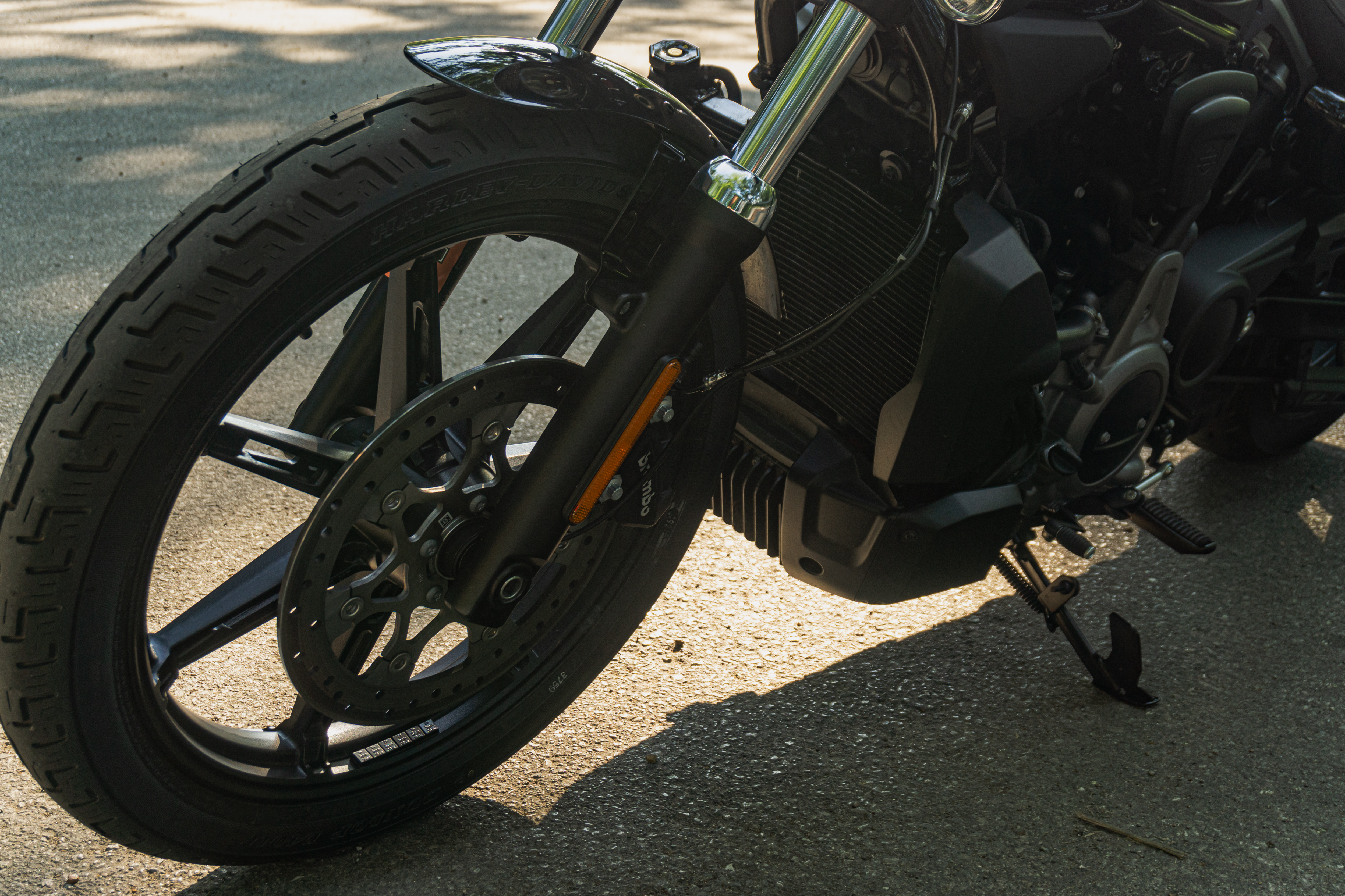 The front wheel and brake of a 2022 Harley-Davidson Nightster in a road