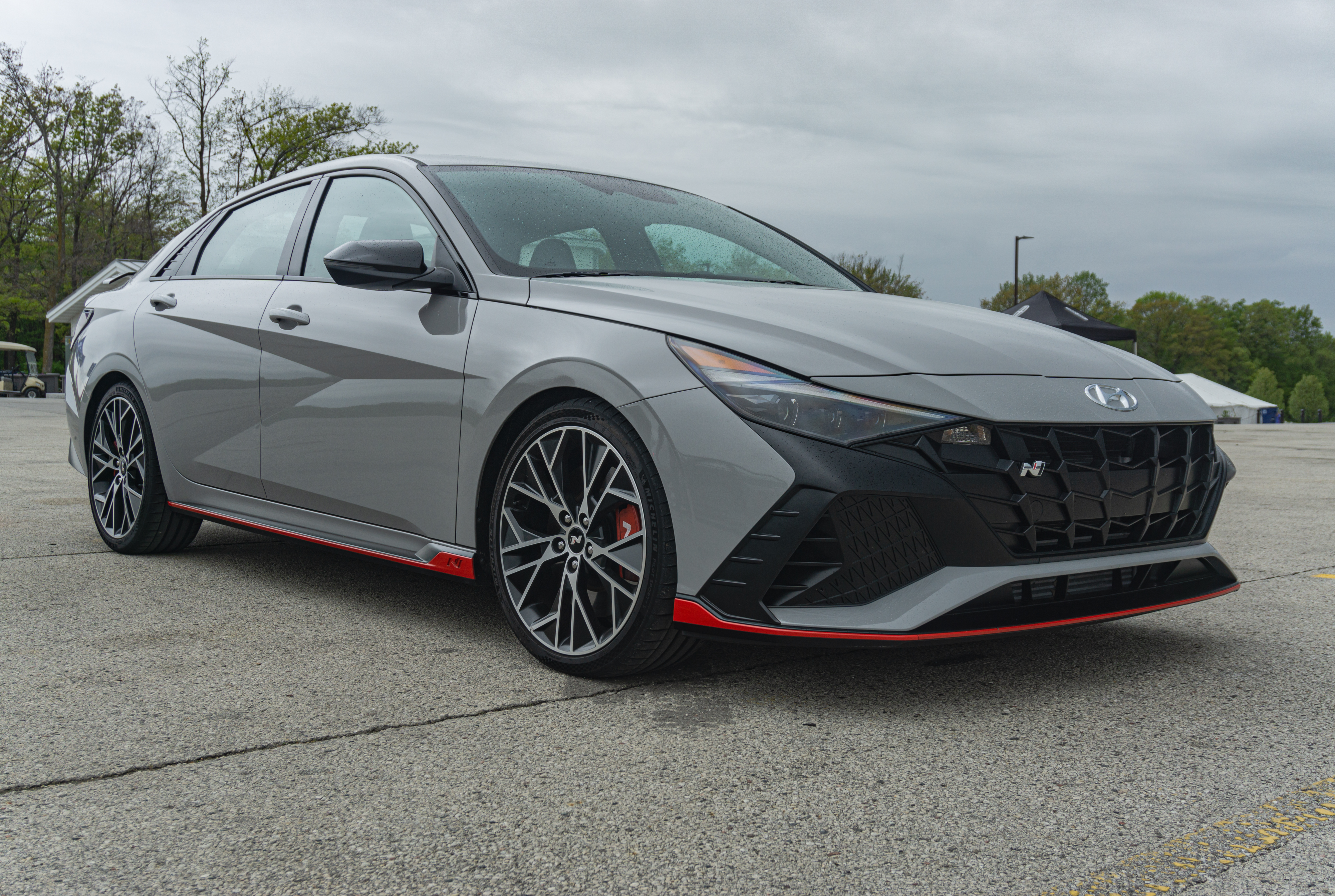 A gray 2022 Hyundai Elantra N DCT in Road America's parking lot