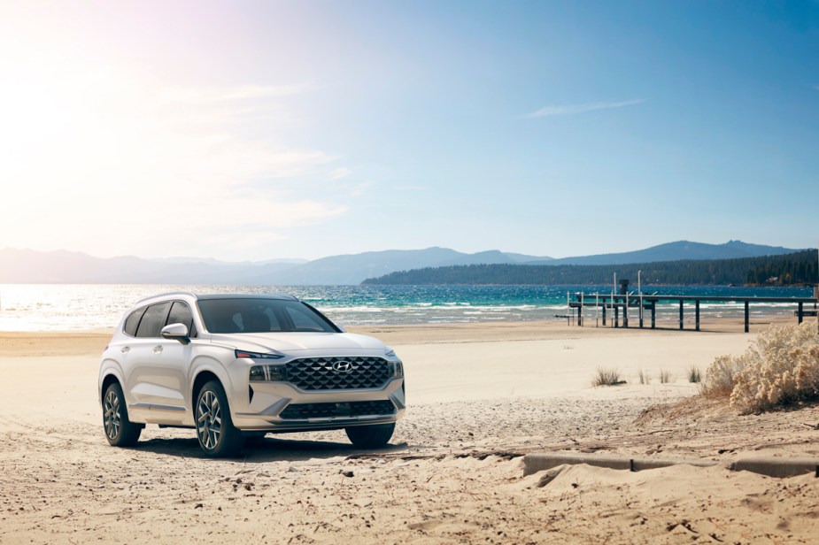 A white 2022 Hyundai Santa Fe at the beach, is it a family SUV?