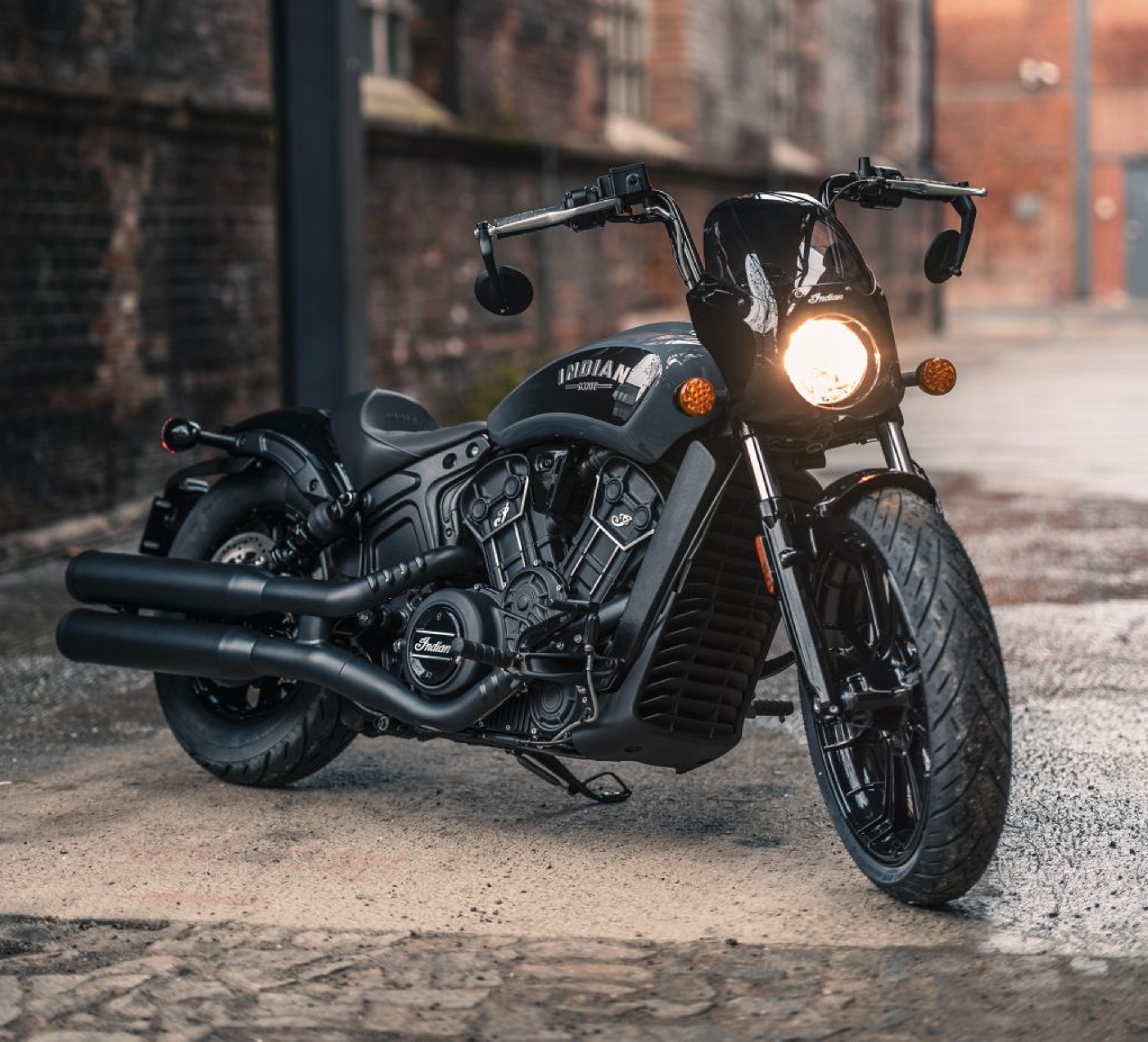 A gray-and-black 2022 Indian Scout Rogue in an alley