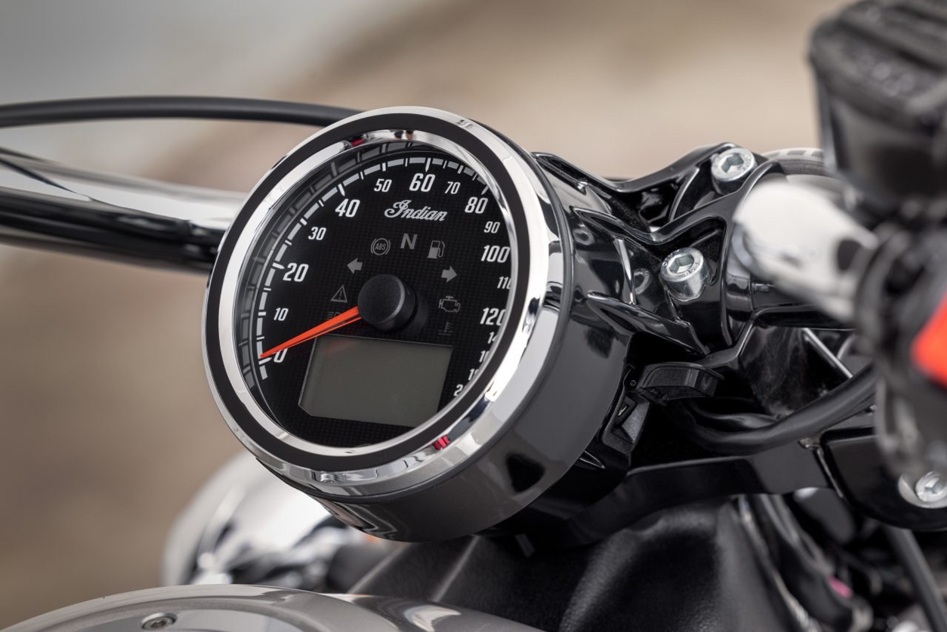 The chrome-rimmed gauge of a 2022 Indian Scout with ABS