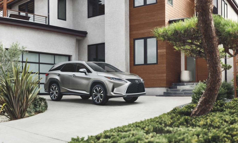 A gray Lexus RX350Lin a driveway. Consumer Reports recommends every luxury midsize SUV from Lexus. 