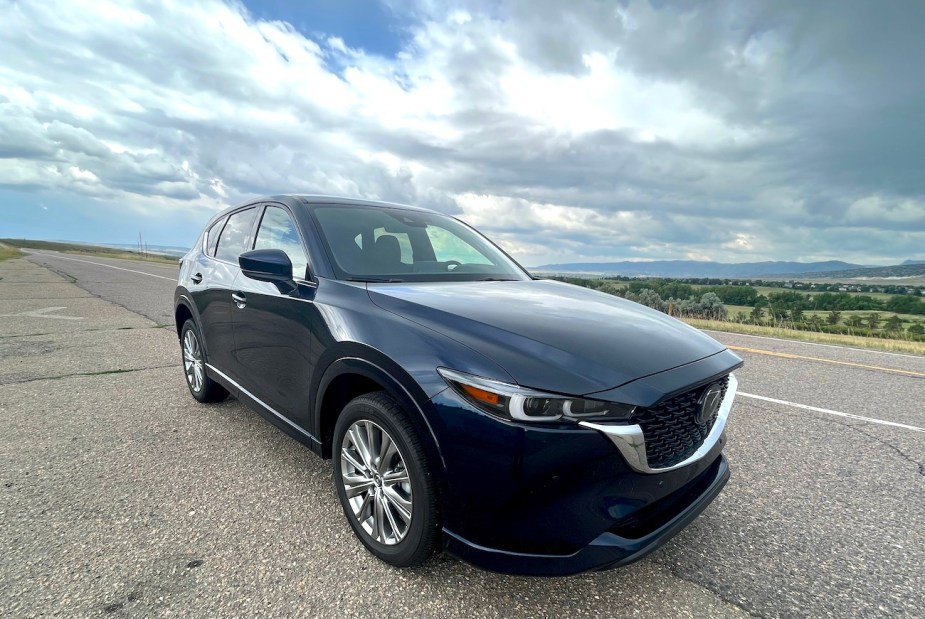 A front corner view of the 2022 Mazda CX-5 Turbo Signature on an open road. Should you buy a Turbo or Turbo Signature?